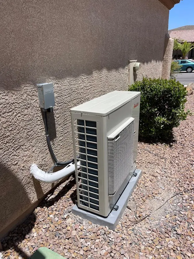 Residential air conditioning condenser unit in South Weber
